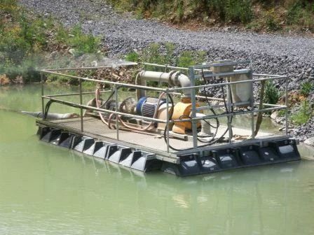 Pump barge in a muddy pond