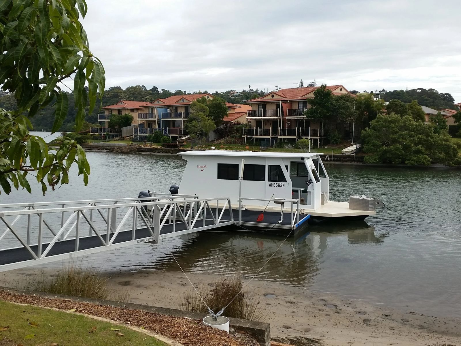 Houseboat moored beside a gangway