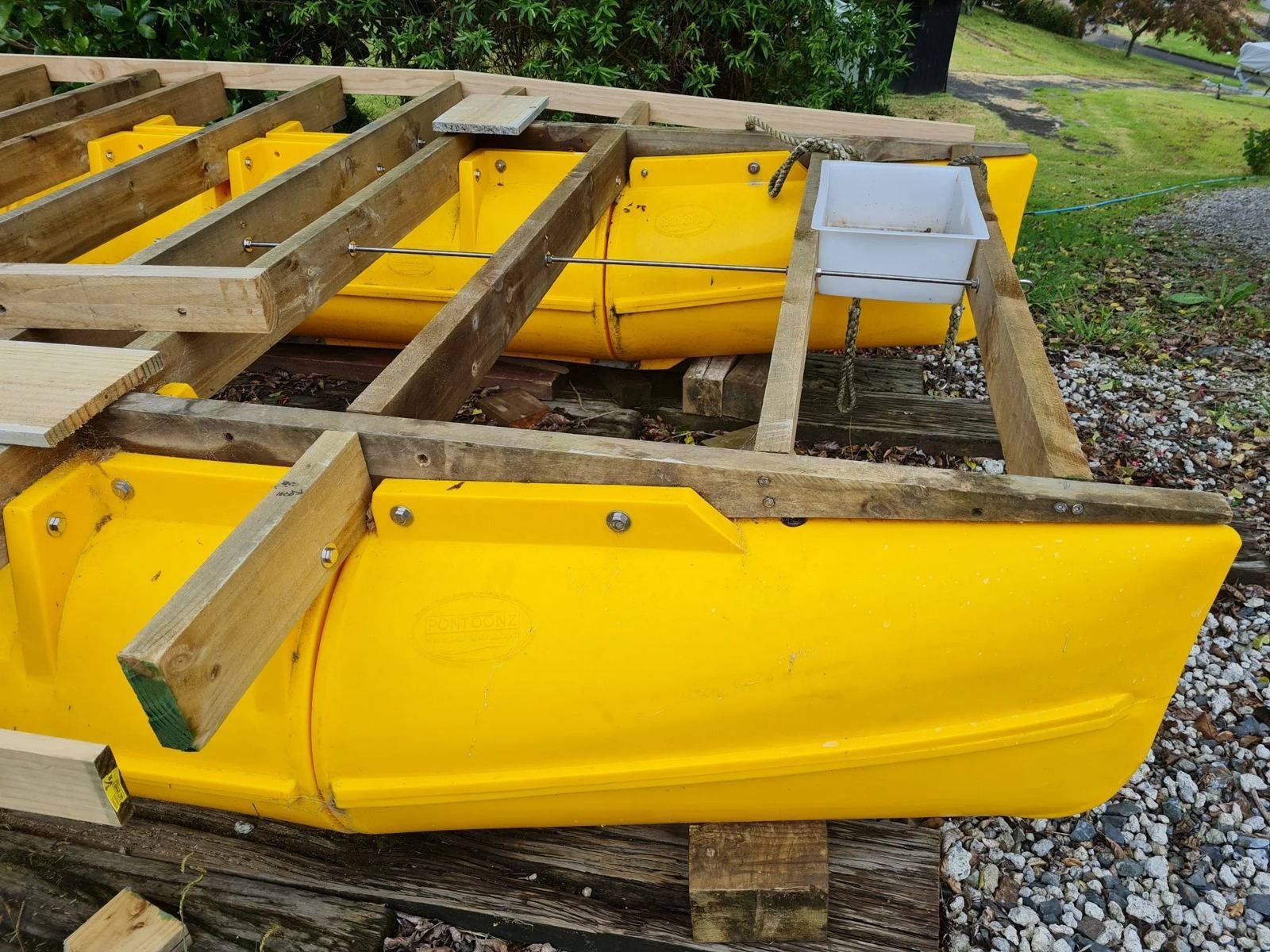 Yellow Pontoonz Main Boat Pods bolted to timber runners during a platform build