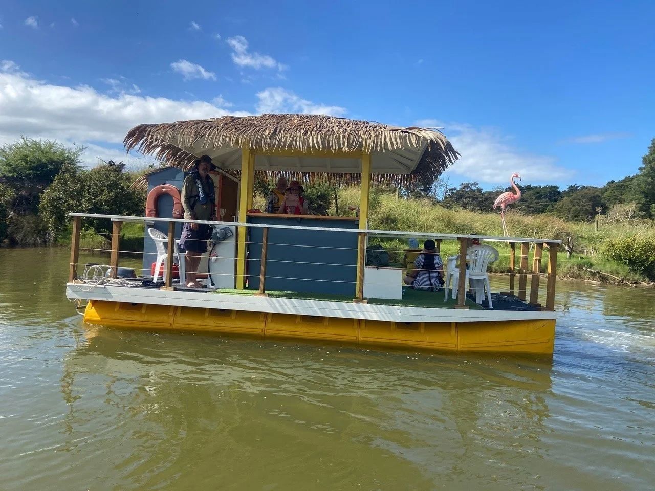 Tiki bar boat with passengers